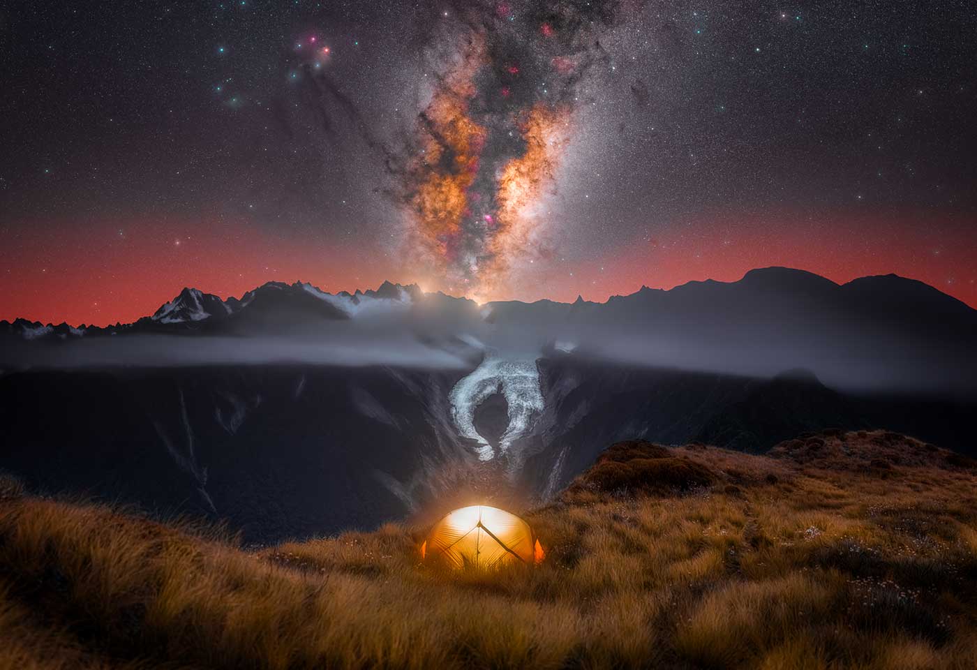 Image of camping with mountains in the view by Larryn Rae